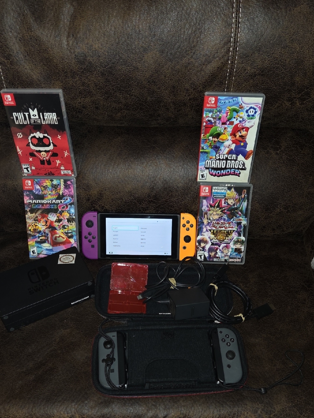 Nintendo Switch with Purple Left & Orange Right Joy-Con Controllers